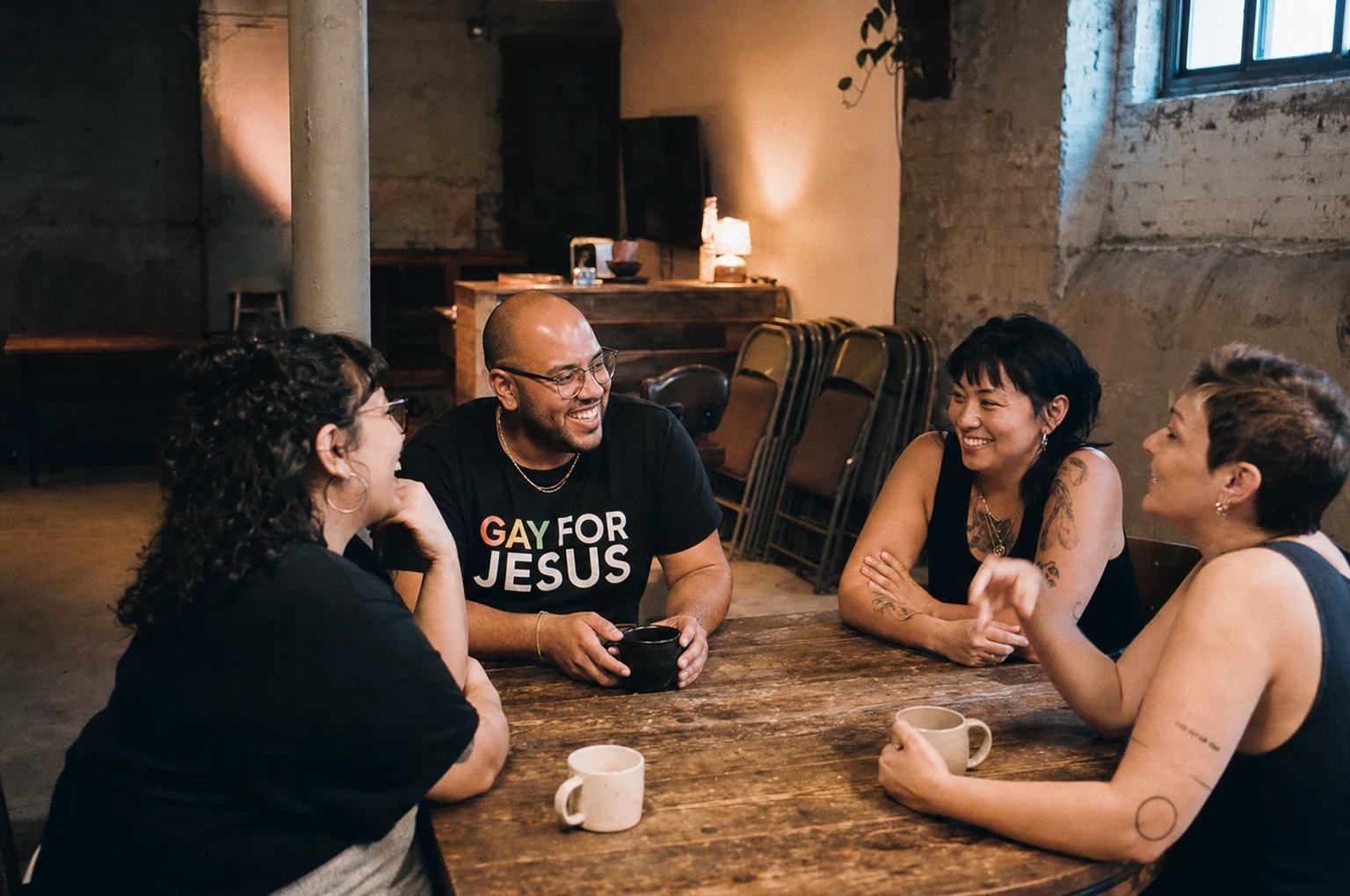 Friends sharing coffee and conversation in a community space